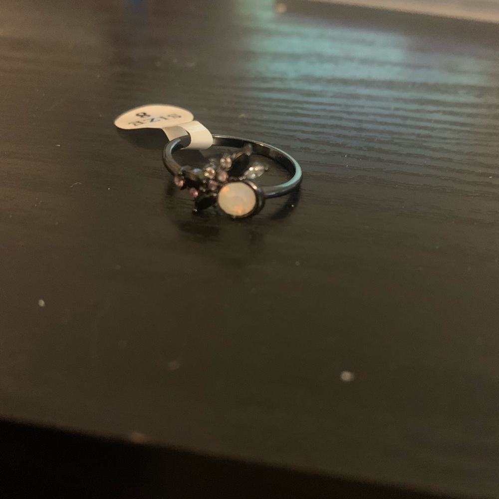 Black coded nickel ring with opal like stone and crystal accents. Size 8